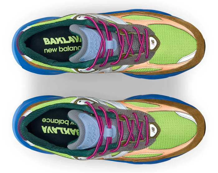 View of brown, blue, and green New Balance shoes.